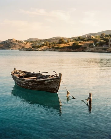 A wooden boat on calm water