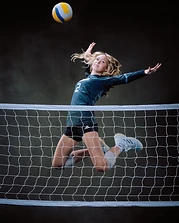 Volleyball player jumping to spike the ball
