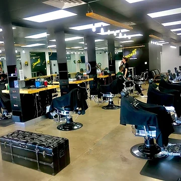 Inside Seven18 Barber Lounge looking toward the front entrance