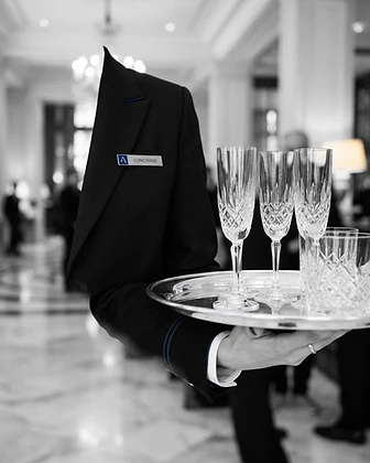 Professional hostess — tailored uniform and crystal service