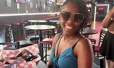 Guest smiling at the sports bar table