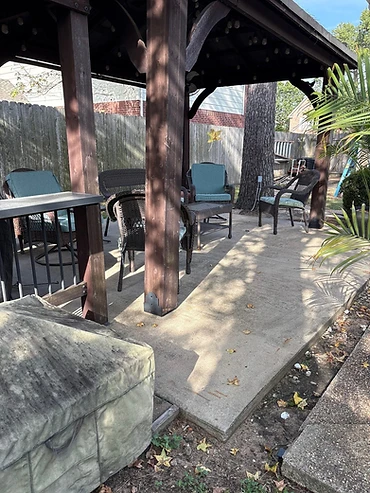Before: bare concrete under the pavilion, backyard pavilion patio in Northwest Houston coated by Bluebonnet Epoxy Co.