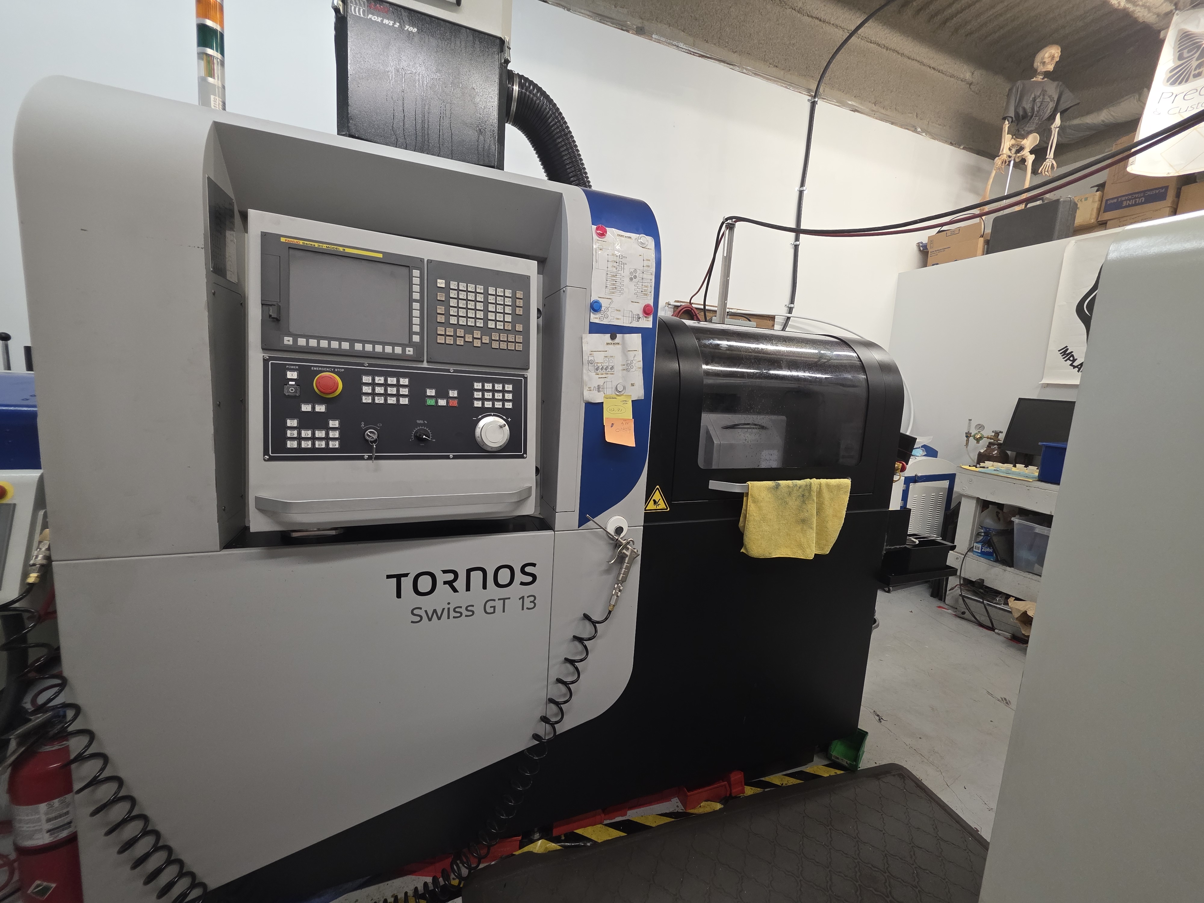 Tornos Swiss GT 13 CNC machining centre inside the Tribal Expression workshop in Calgary
