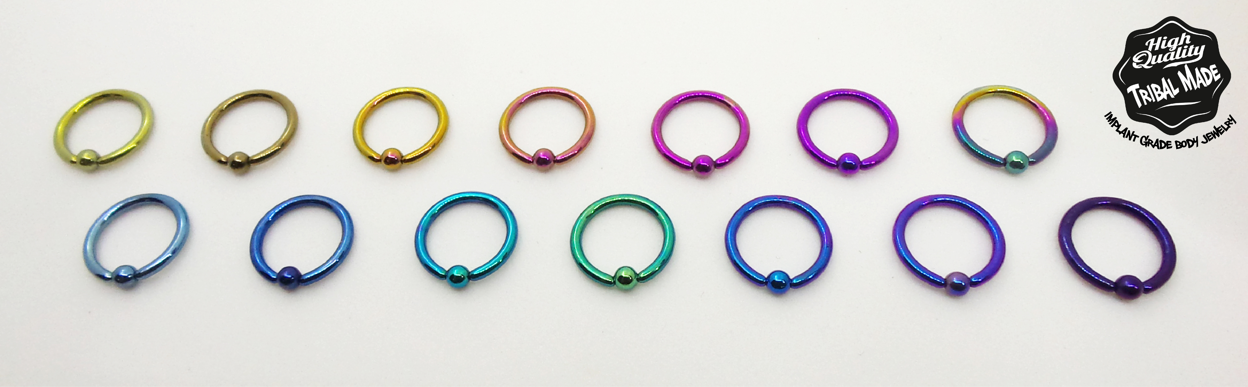 Captive bead rings in fourteen metal colours from gold to iridescent rainbow, Tribal Made implant grade body jewelry made in Calgary Alberta