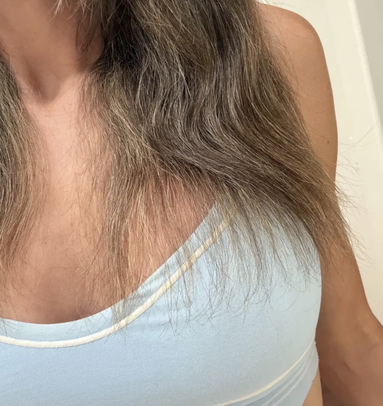 Karmel's hair after it was burnt and damaged in June