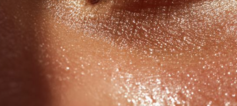 Close-up of a hydrated eye and cheek with luminous skin