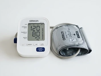 Home blood pressure monitor with arm cuff