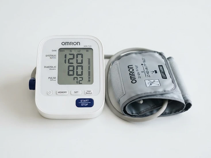 Home blood pressure monitor with arm cuff