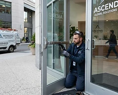 Locksmith servicing a commercial storefront door in Centennial, Colorado