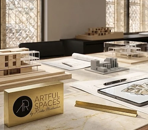 Architect's desk with architectural models and brass plaque
