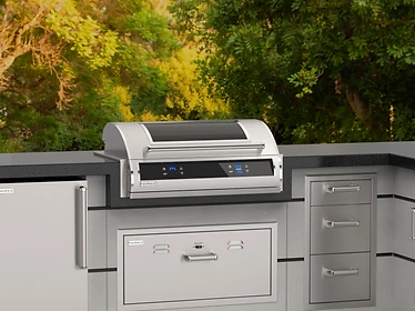 Fire Magic EL500i outdoor grill station with digital control panel in a stone countertop