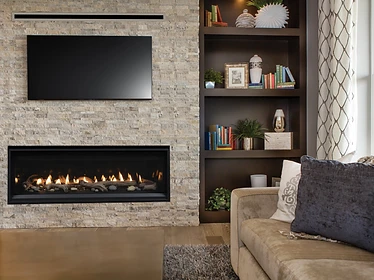 Astria Compass 55 linear gas fireplace with built-in shelving and stacked stone veneer