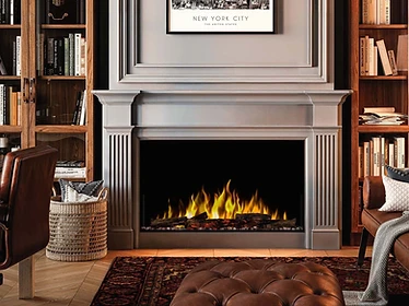 Dimplex Quest 48 fireplace with gray mantel surround and built-in bookshelves
