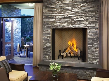 Astria Citadel 48 fireplace with herringbone brick interior and rustic stone surround