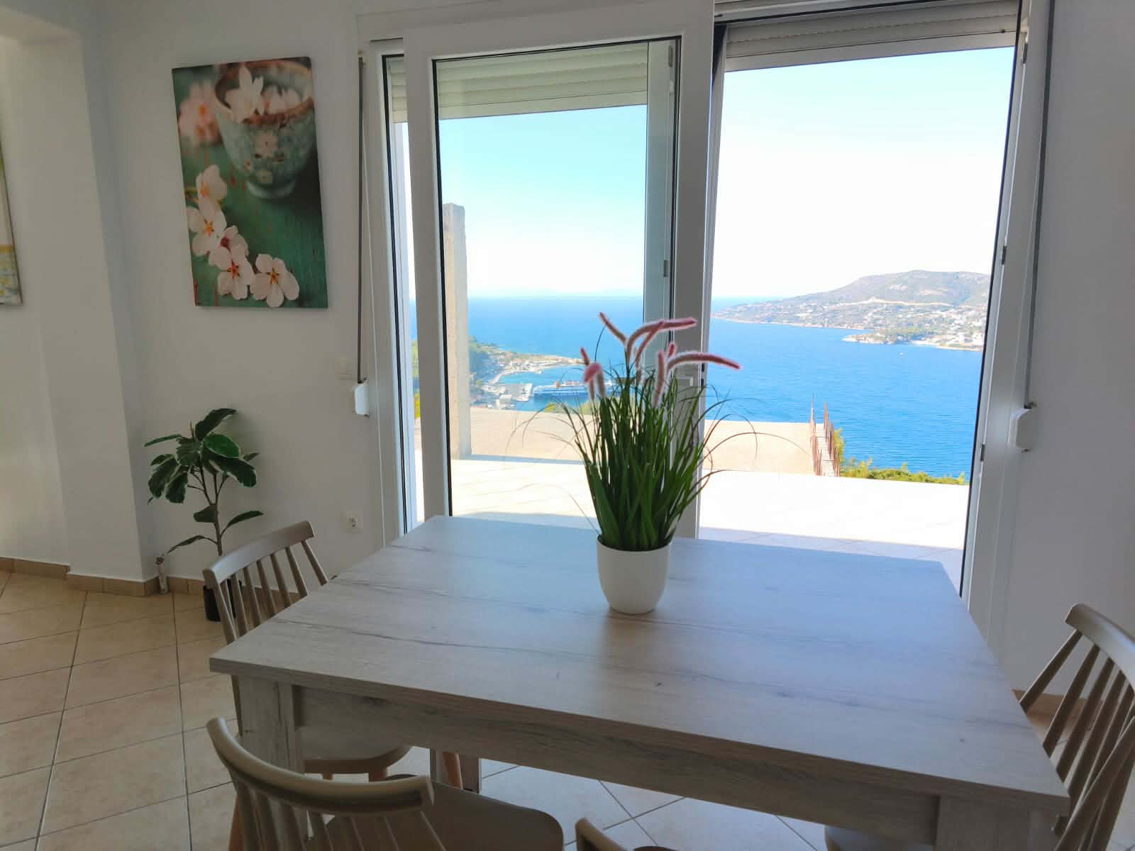 Dining area with plant & sea-view sliding door