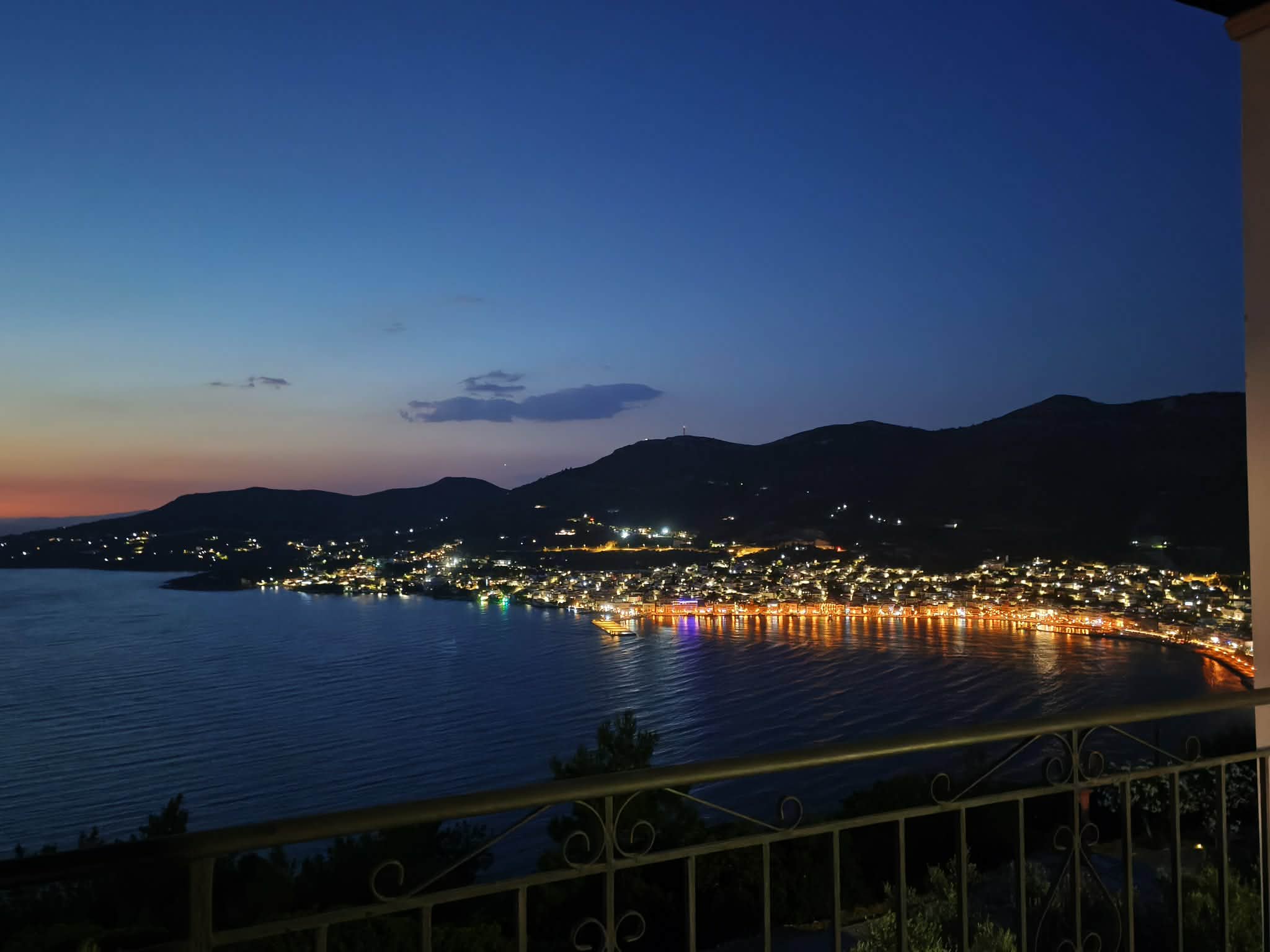 Town lights reflecting on the bay at night