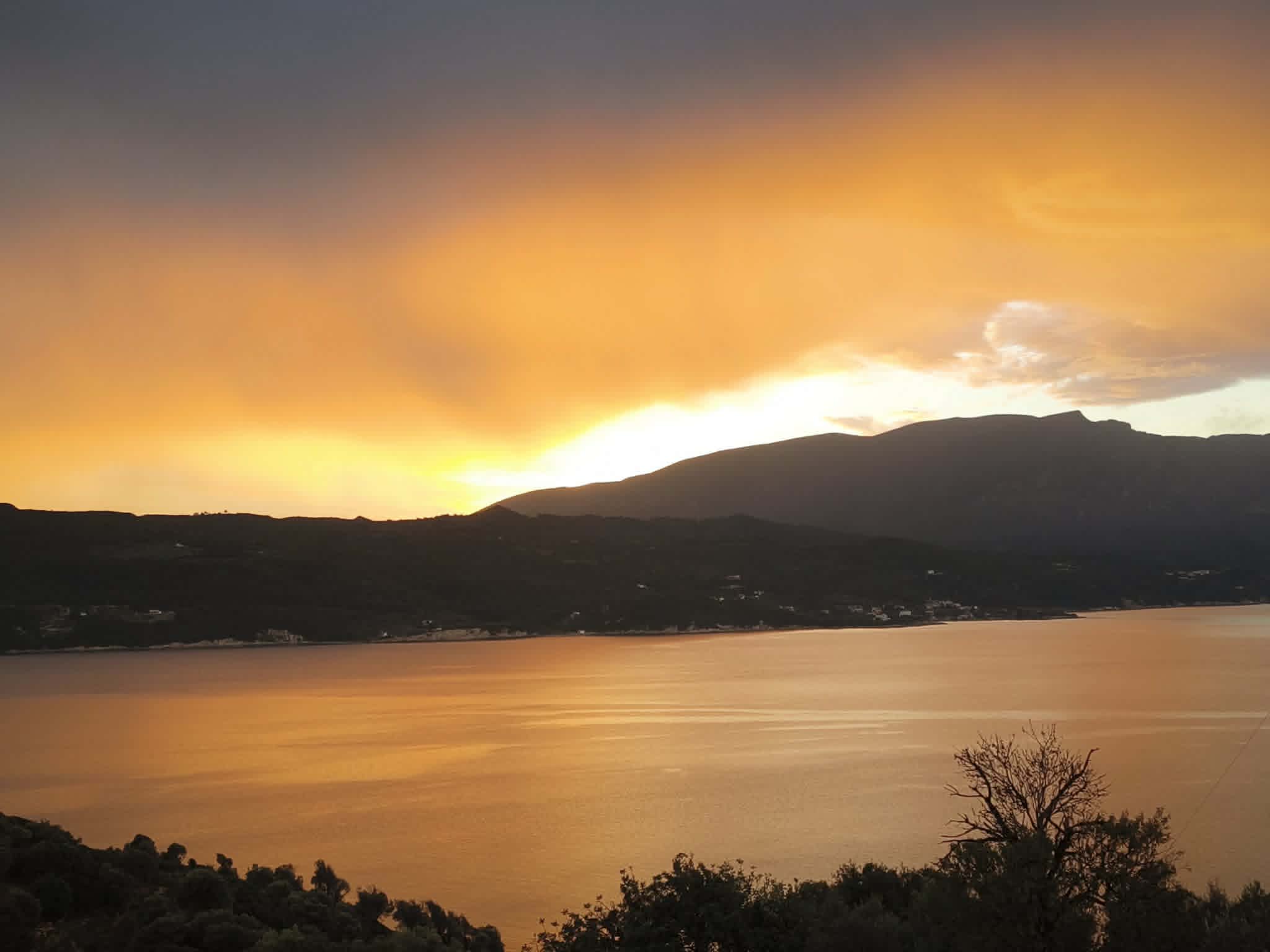 Sunset over the sea & mountains from the terrace