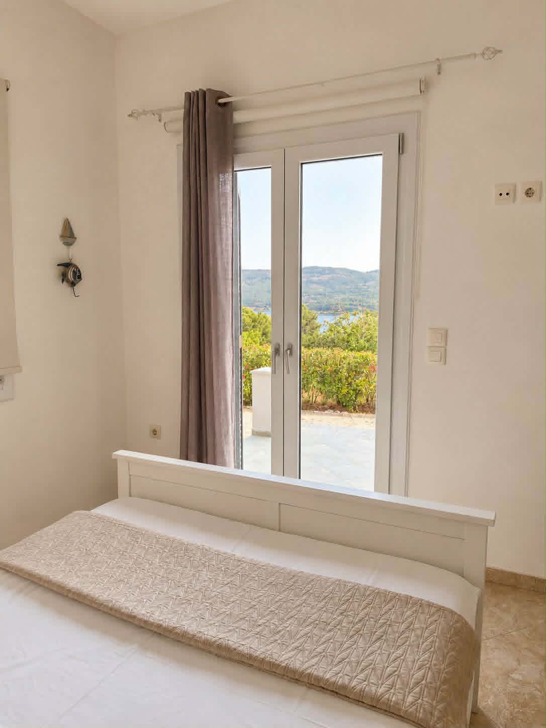 Bedroom with double bed & terrace view