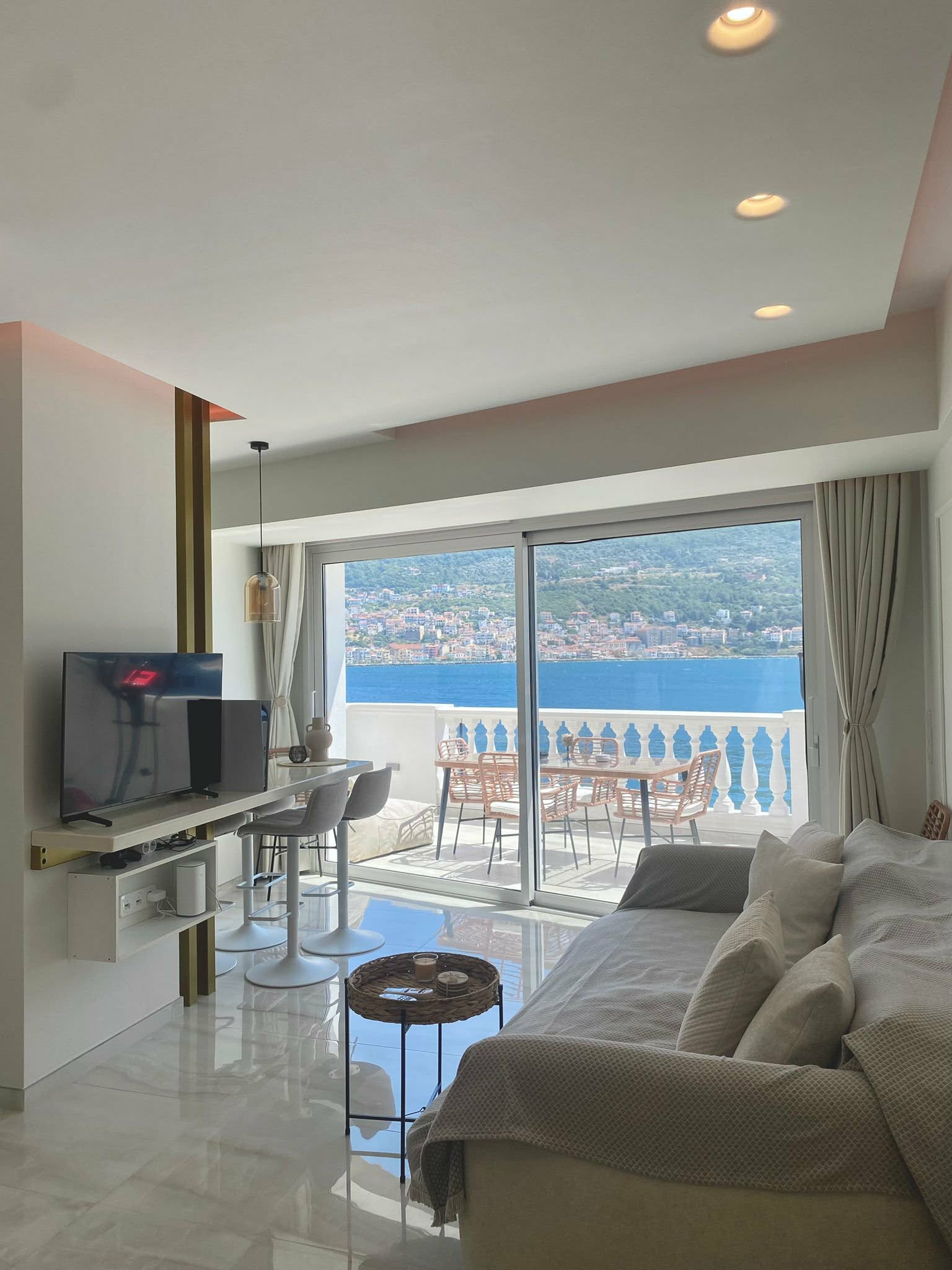 Living & dining area opening to the sea