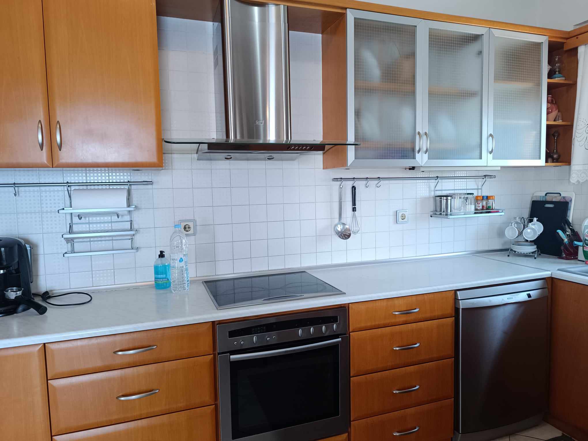 Kitchen with cooktop, oven & range hood