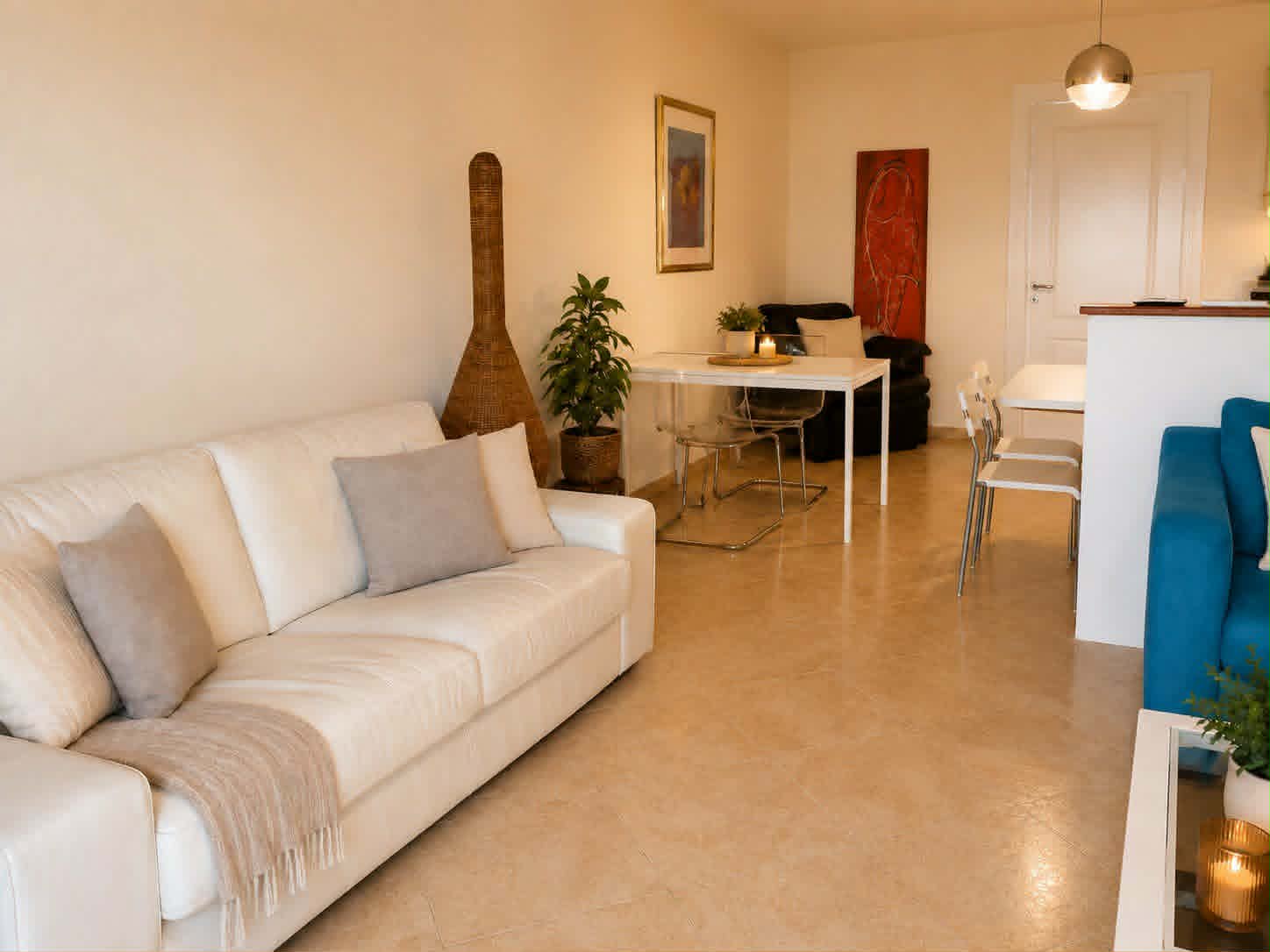 Living room with white sofa & dining nook