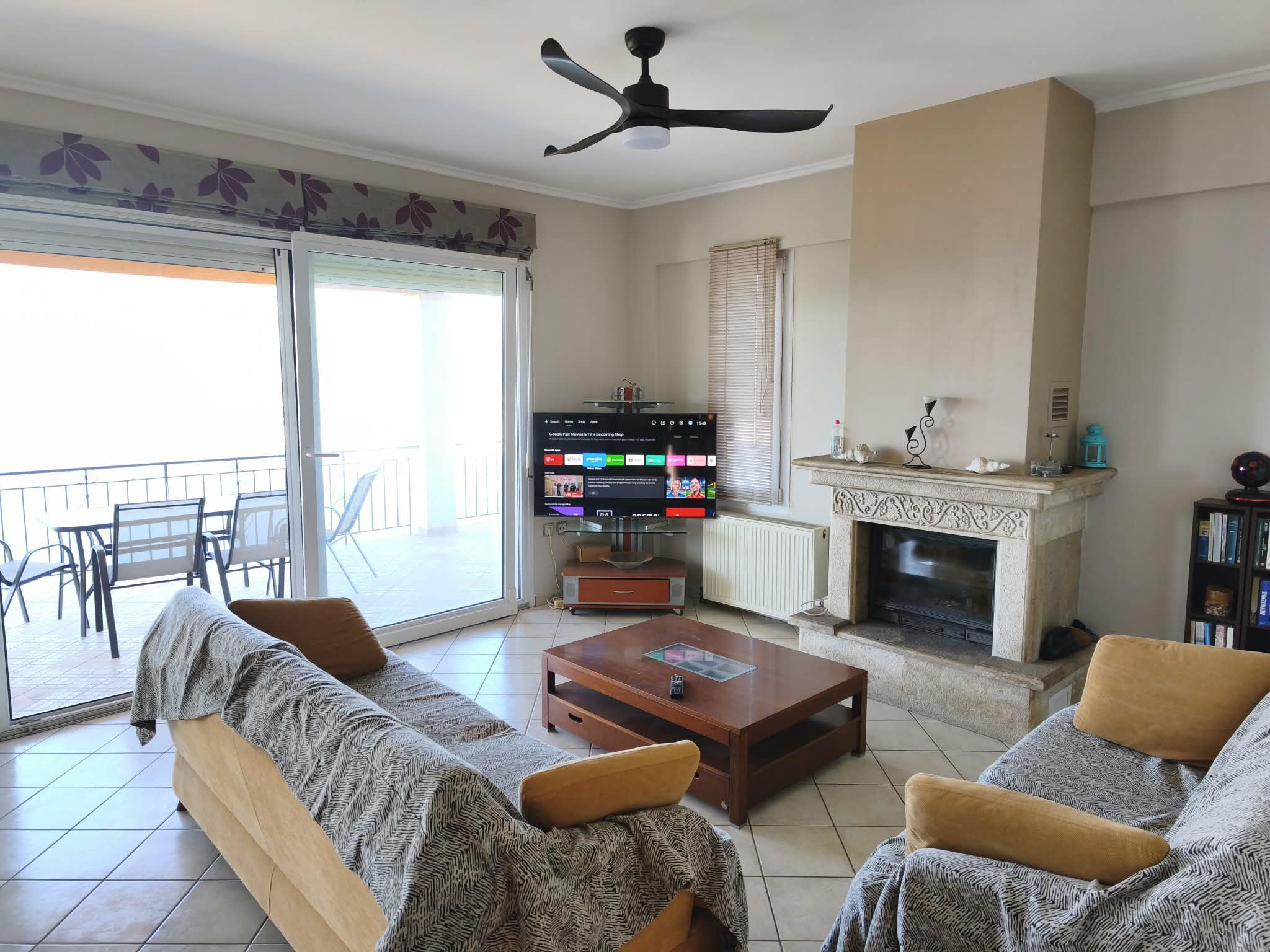 Living room with fireplace & smart TV