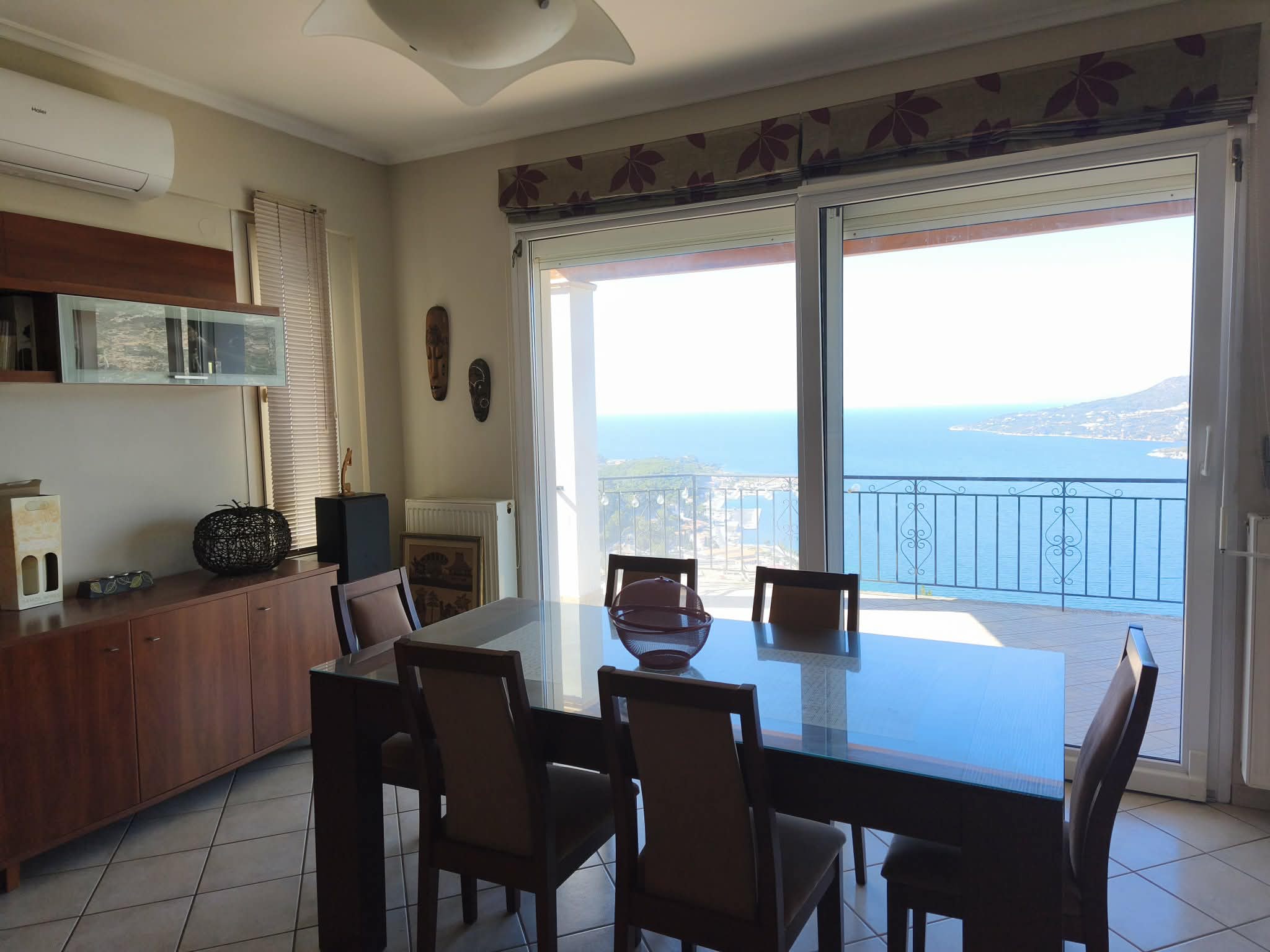 Dining area opening to the sea-view balcony