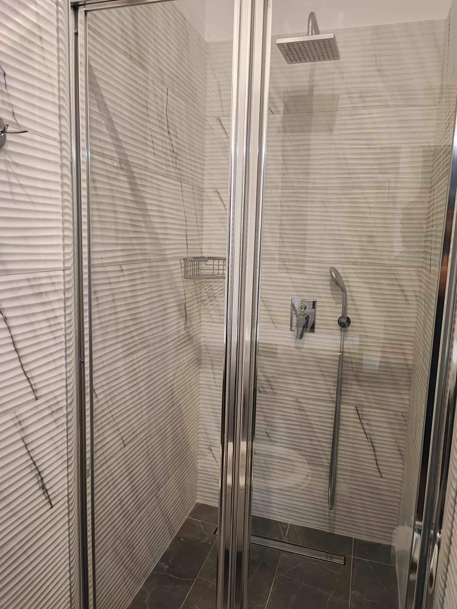 Walk-in shower with rainfall head