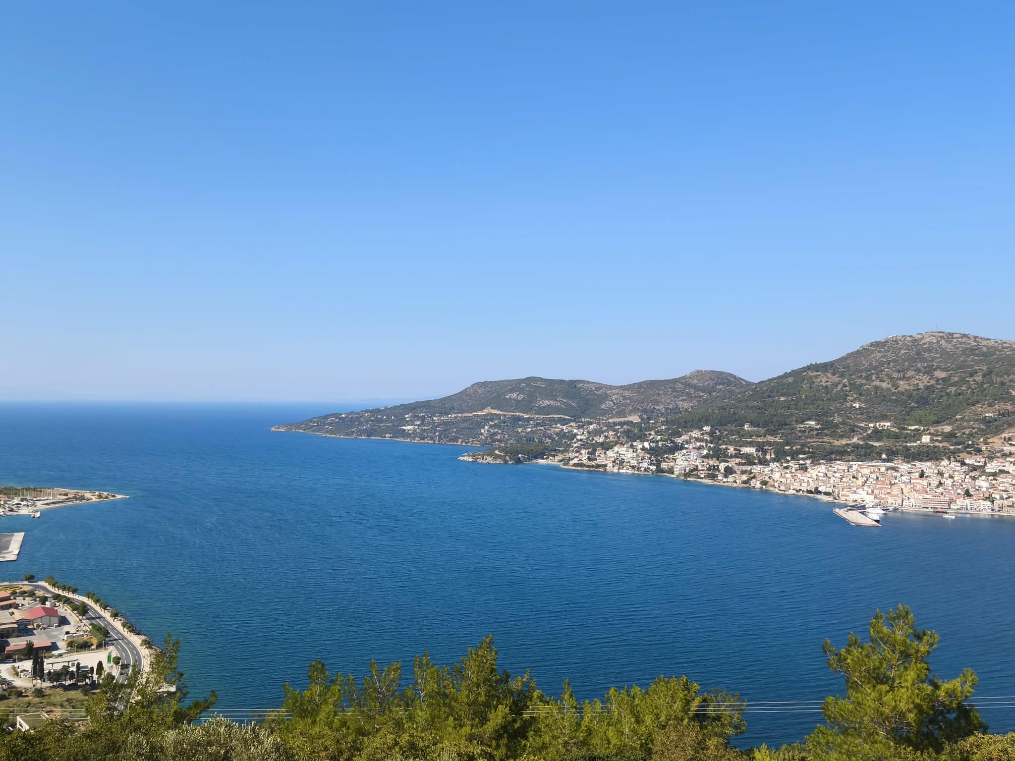 Panoramic bay, coastline & distant mountains