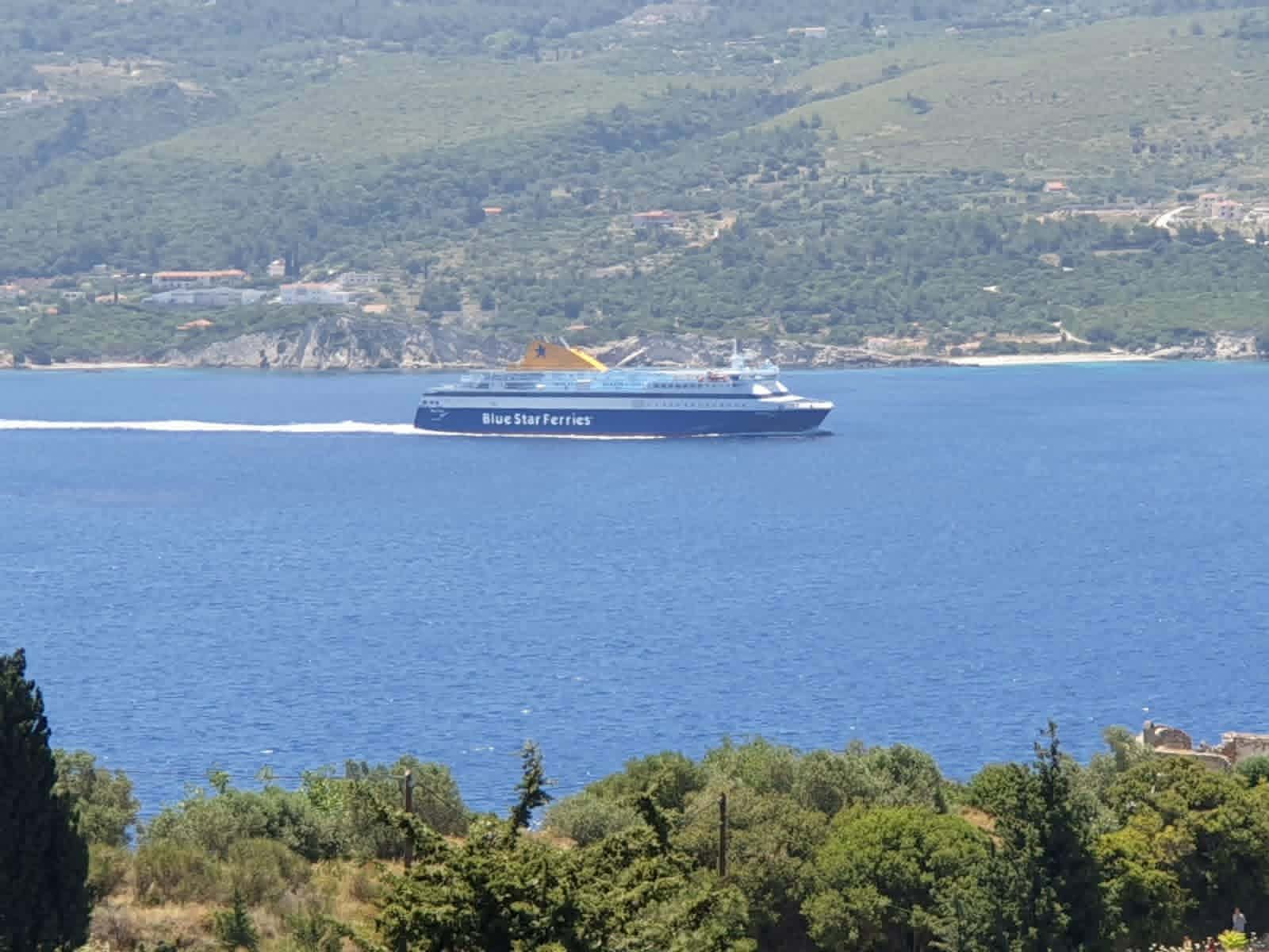 Ferry crossing the blue sea from the terrace