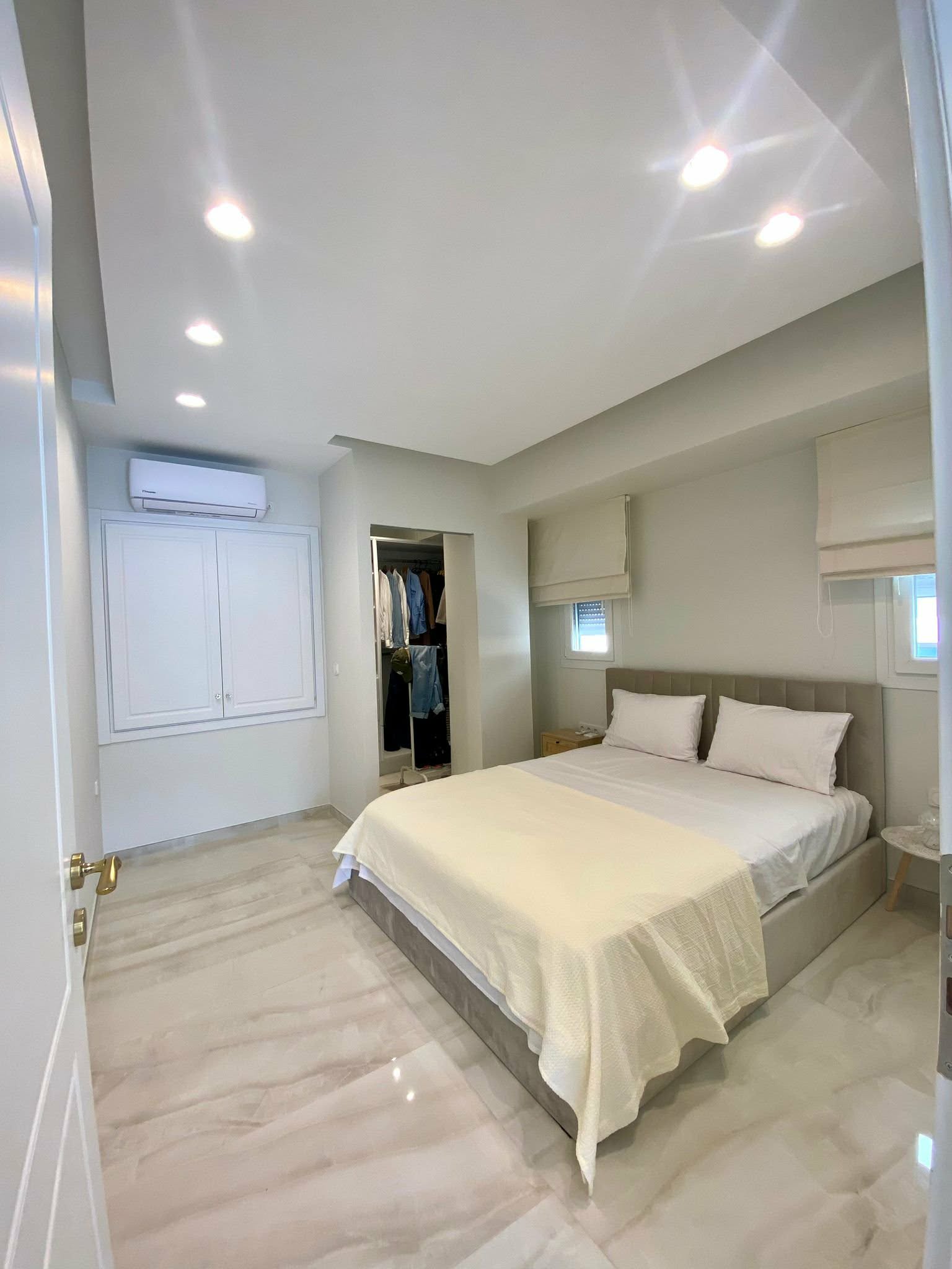 Bedroom with double bed & walk-in closet