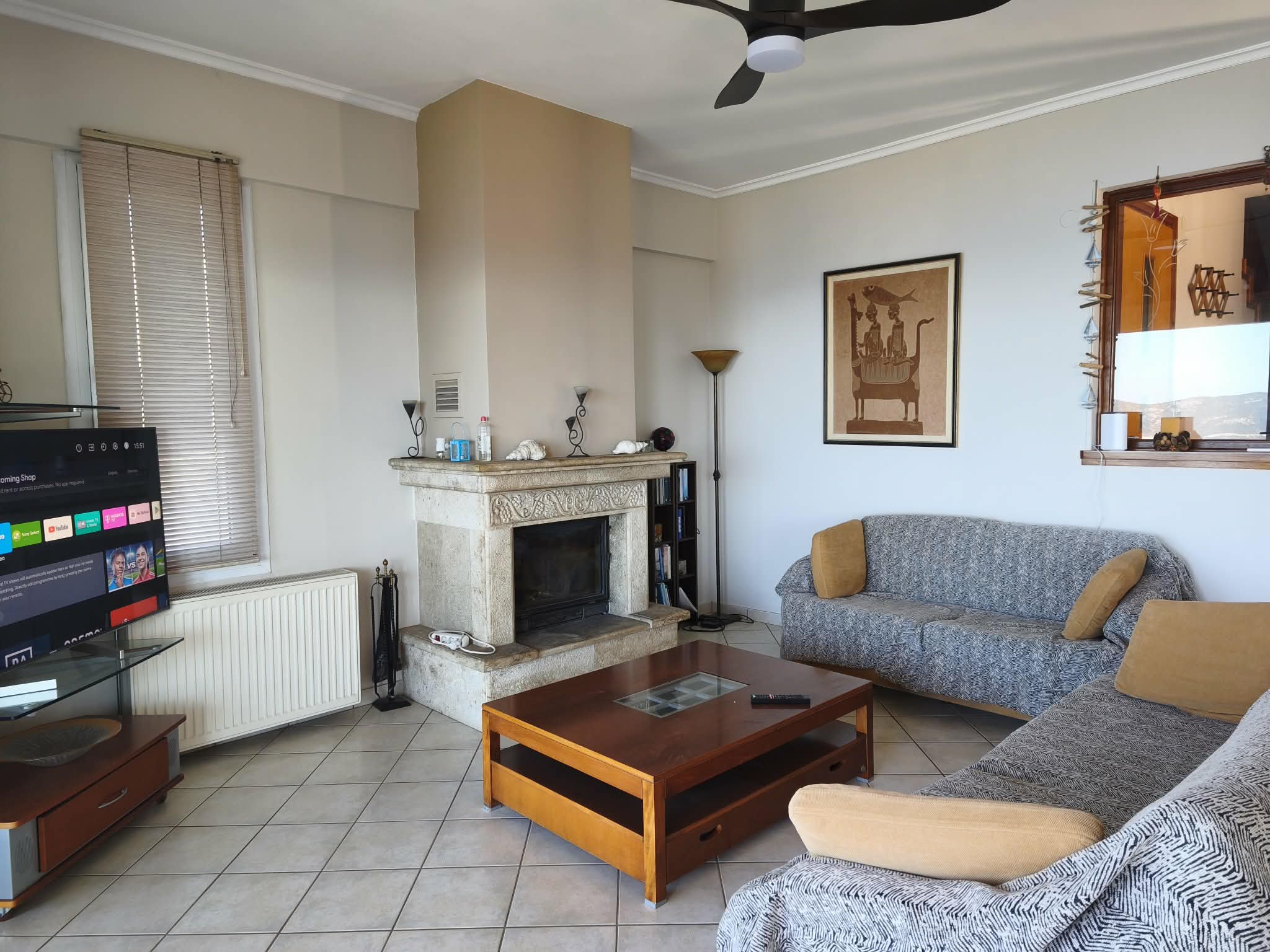 Living room with carved fireplace & sea-view niche
