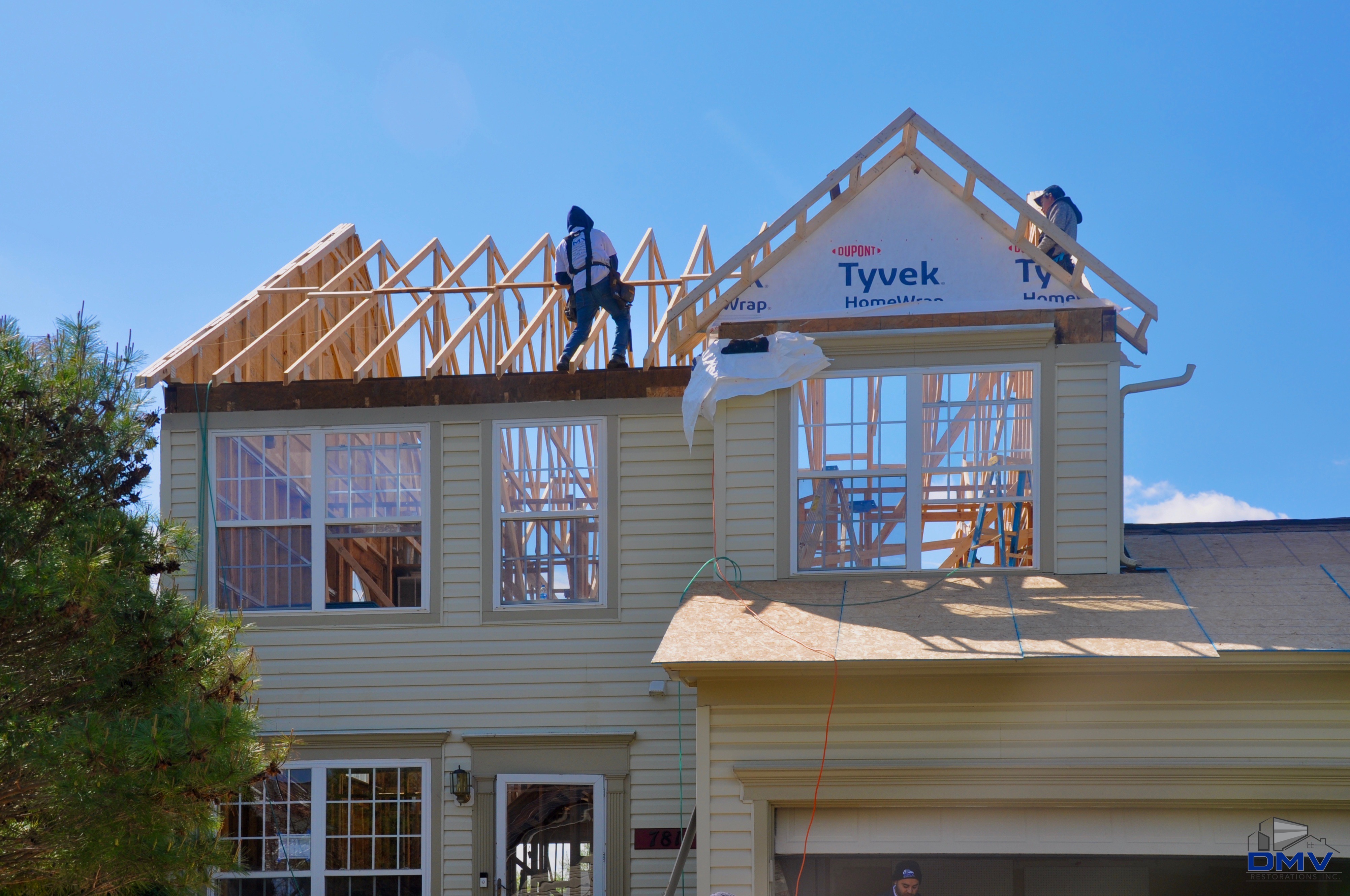 DMV Restorations Inc. crew transforming a home exterior