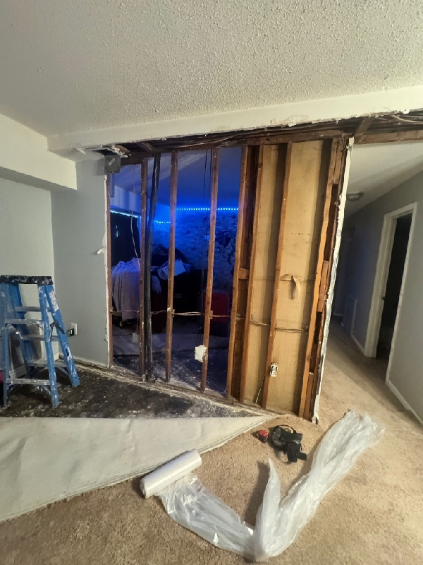 Demolition exposing wall studs during interior restoration