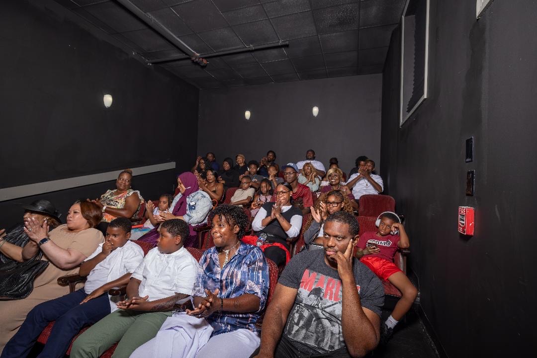 A full screening room watching the premiere