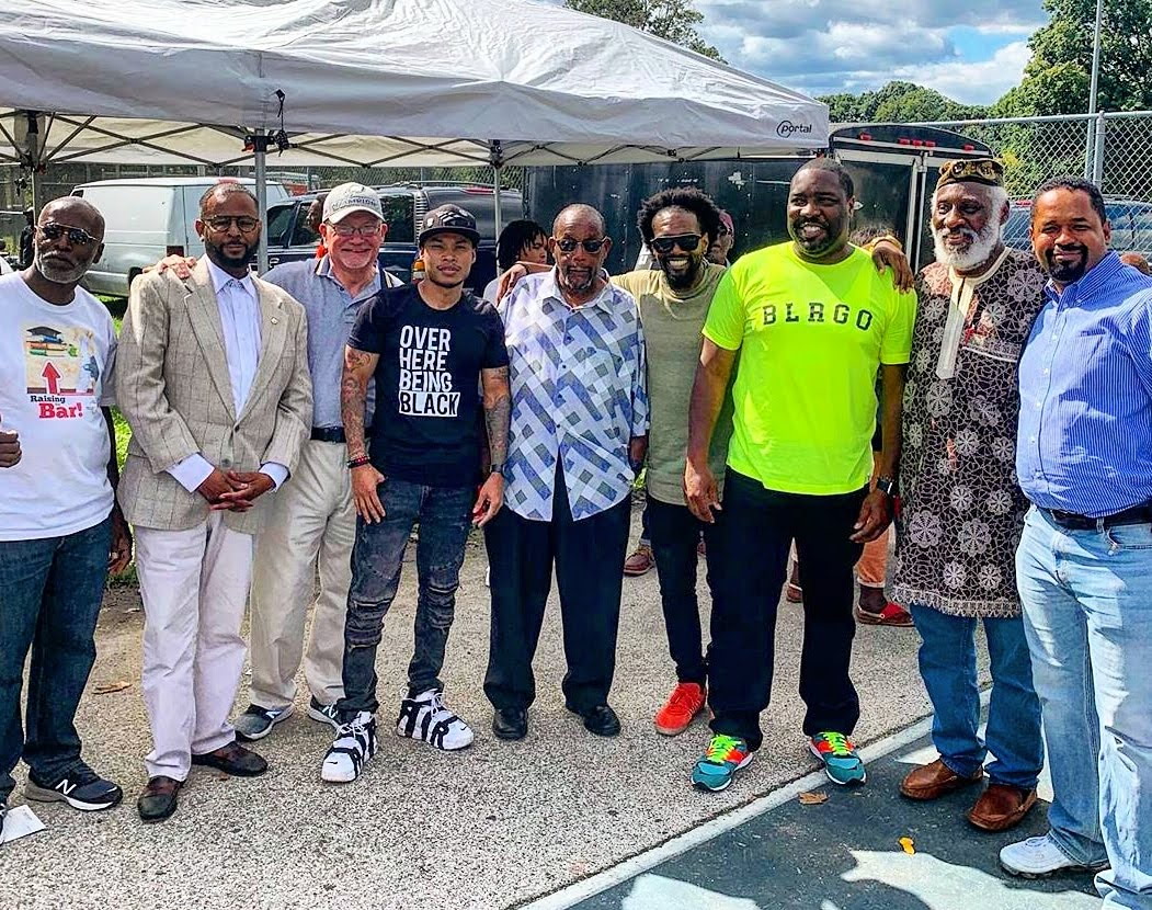 Organizers and partners standing together at a community event