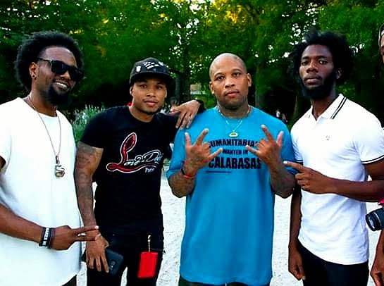 Five organizers standing together outdoors at a summer community gathering