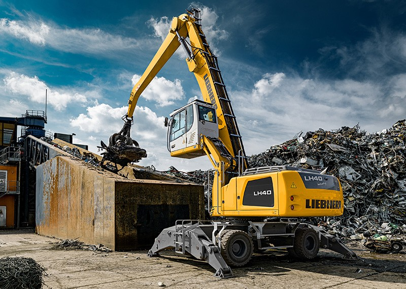 Liebherr material handler at industrial golden hour