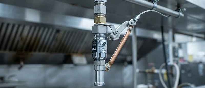 New kitchen hood fire suppression nozzle and piping installation