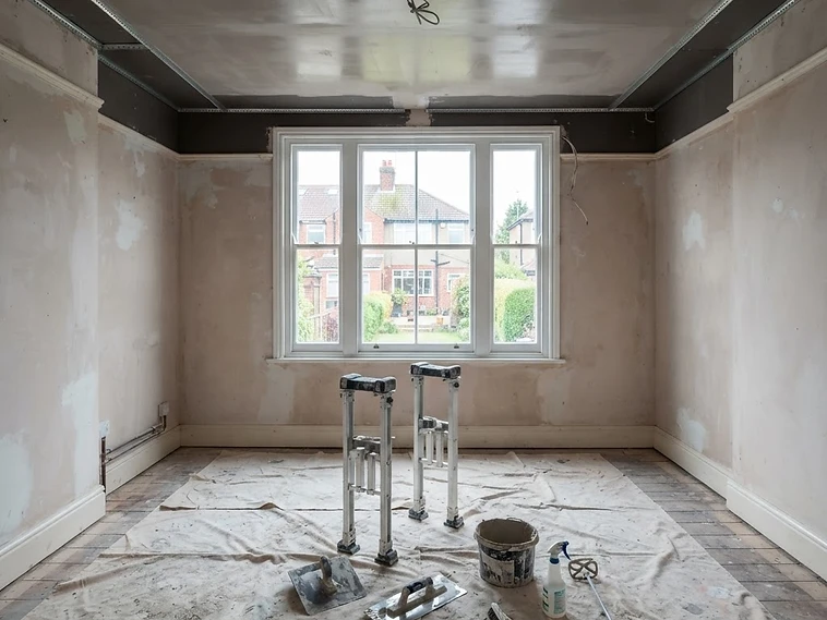 Interior ceiling being plastered in an empty room