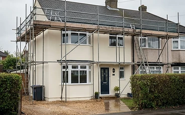 Freshly rendered exterior of a UK semi-detached house