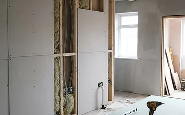 Dry lining installation on stud walls in a property extension