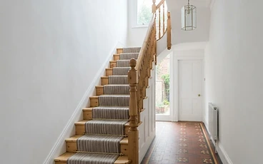 Freshly plastered hallway and staircase in a Victorian terraced house