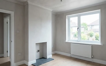 Freshly skimmed living room with smooth white walls and ceiling