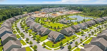 Aerial view of a growing Cane Bay neighborhood with new homes and fresh lawns in the South Carolina Lowcountry