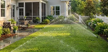 Summers Corner backyard with a newly installed underground irrigation sprinkler system watering a fresh green lawn in South Carolina