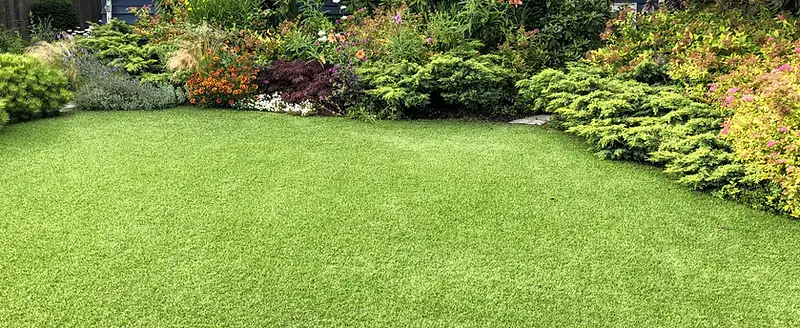 Healthy green Lowcountry lawn with irrigated turf and landscaped beds