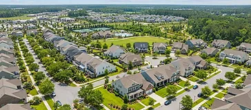 New Nexton home with fresh sod being watered by irrigation sprinklers during establishment in the South Carolina Lowcountry