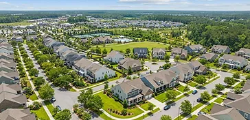 New Nexton home with fresh sod being watered by irrigation sprinklers during establishment in the South Carolina Lowcountry