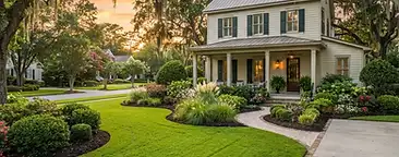 Newly landscaped front yard in a South Carolina Lowcountry neighborhood with fresh mulch beds, shrubs, and healthy lawn